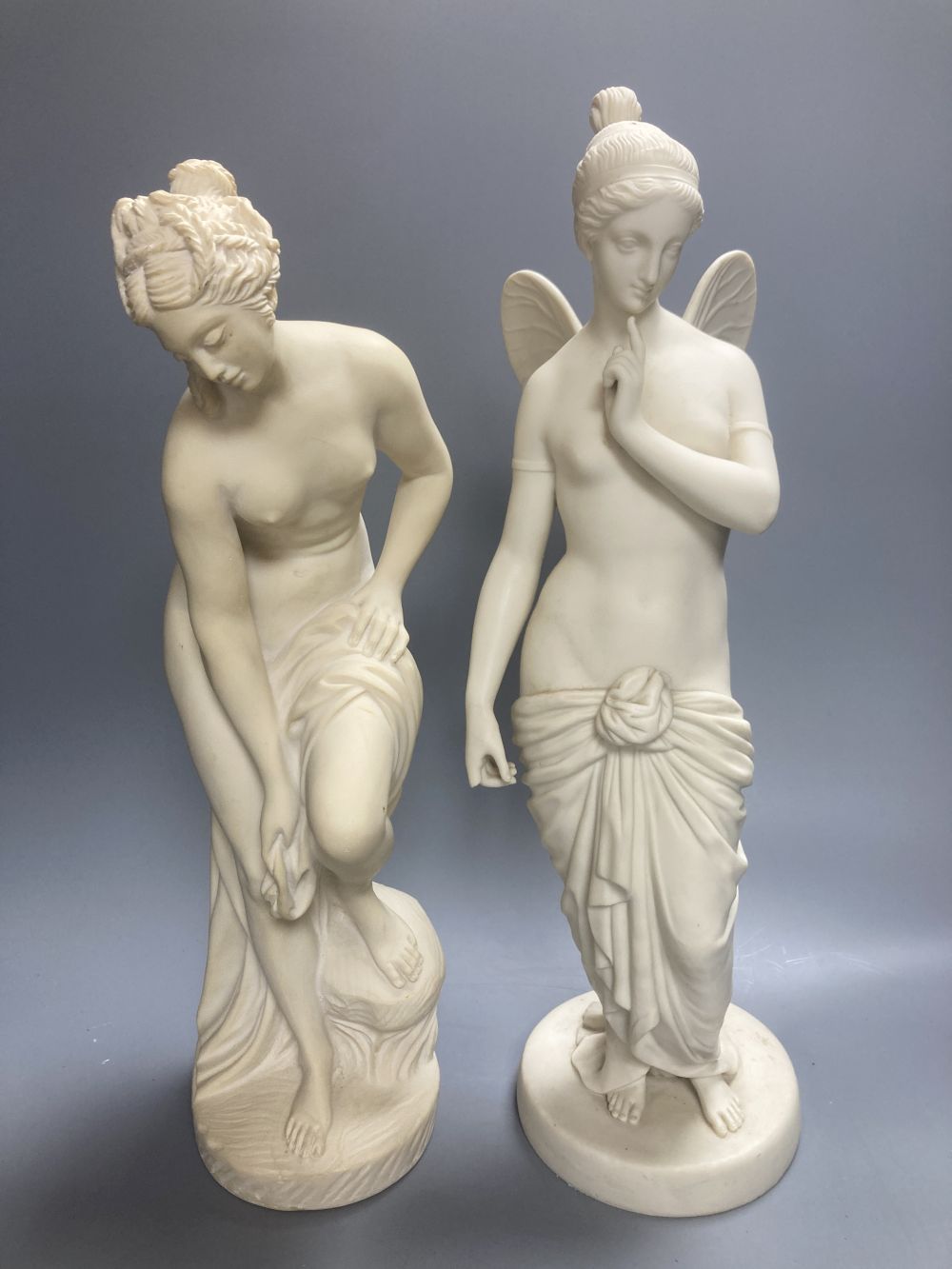 A Copeland Parian figure of a winged maiden and a later composition figure of Venus bathing, H 43cm